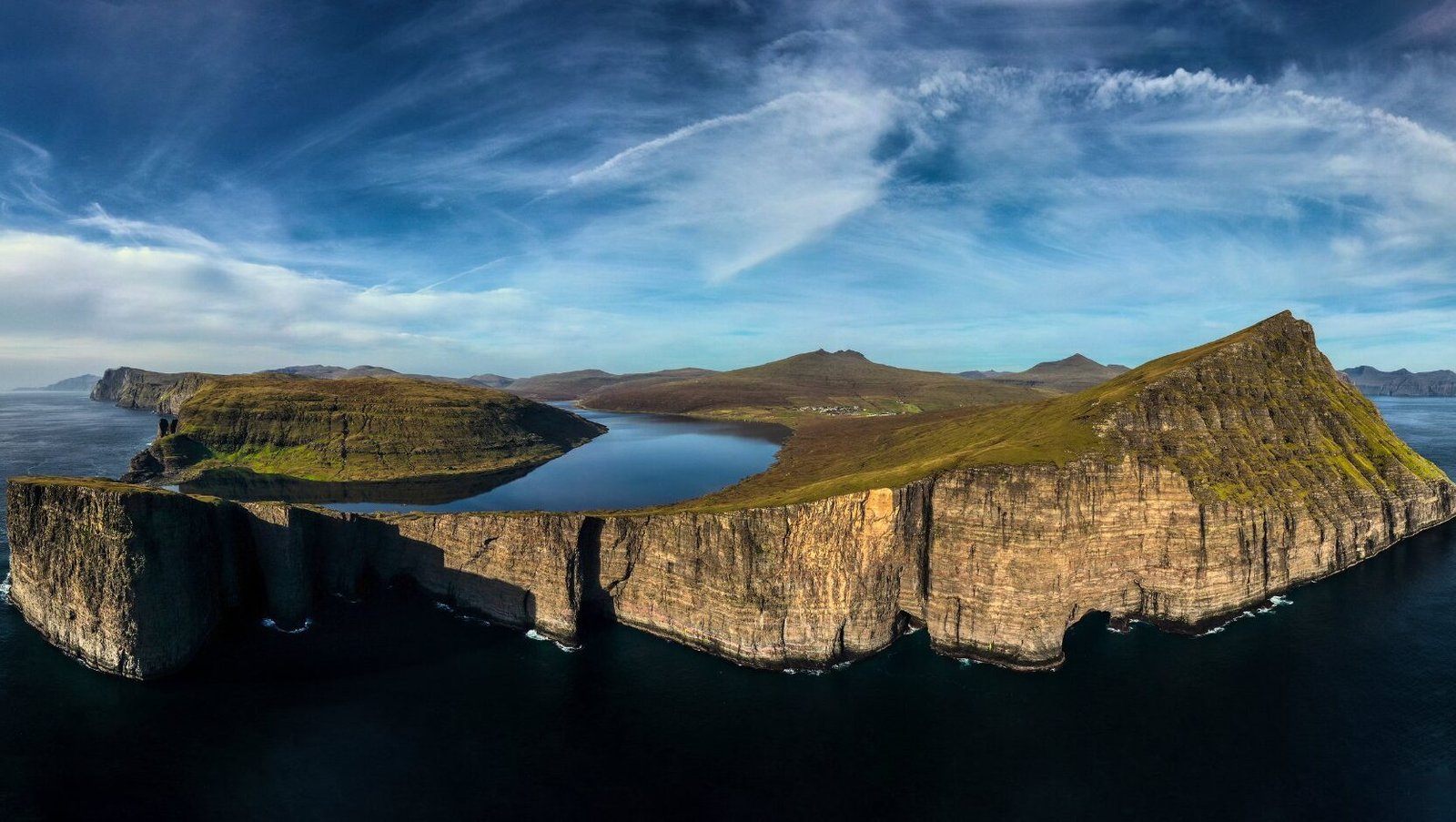 Drone Shot of Trælanípan also known as the lake above the ocean.