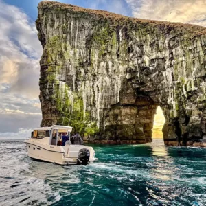 A boat approaches drangarnir