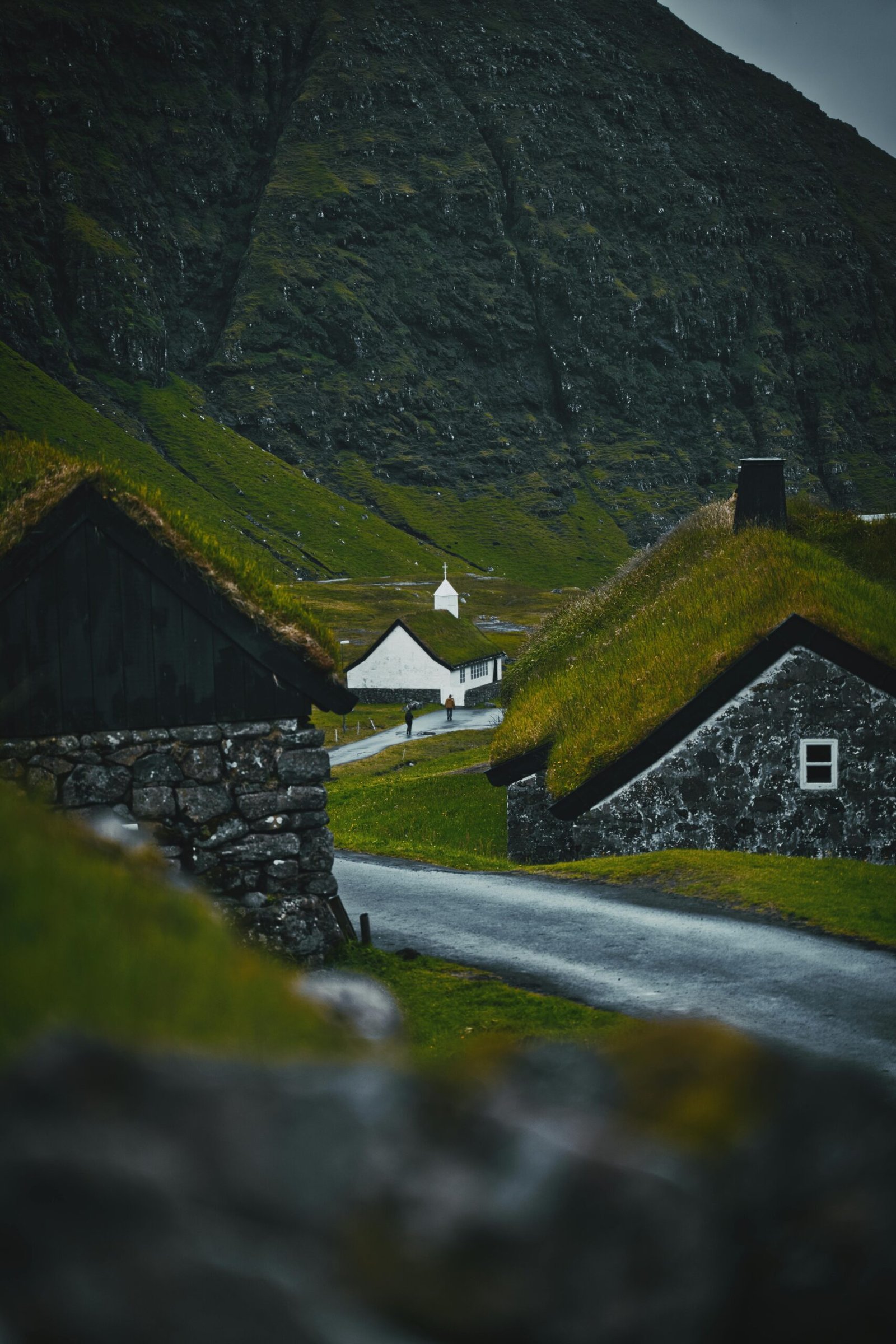 image of church in Saksun between two turf roofed houses