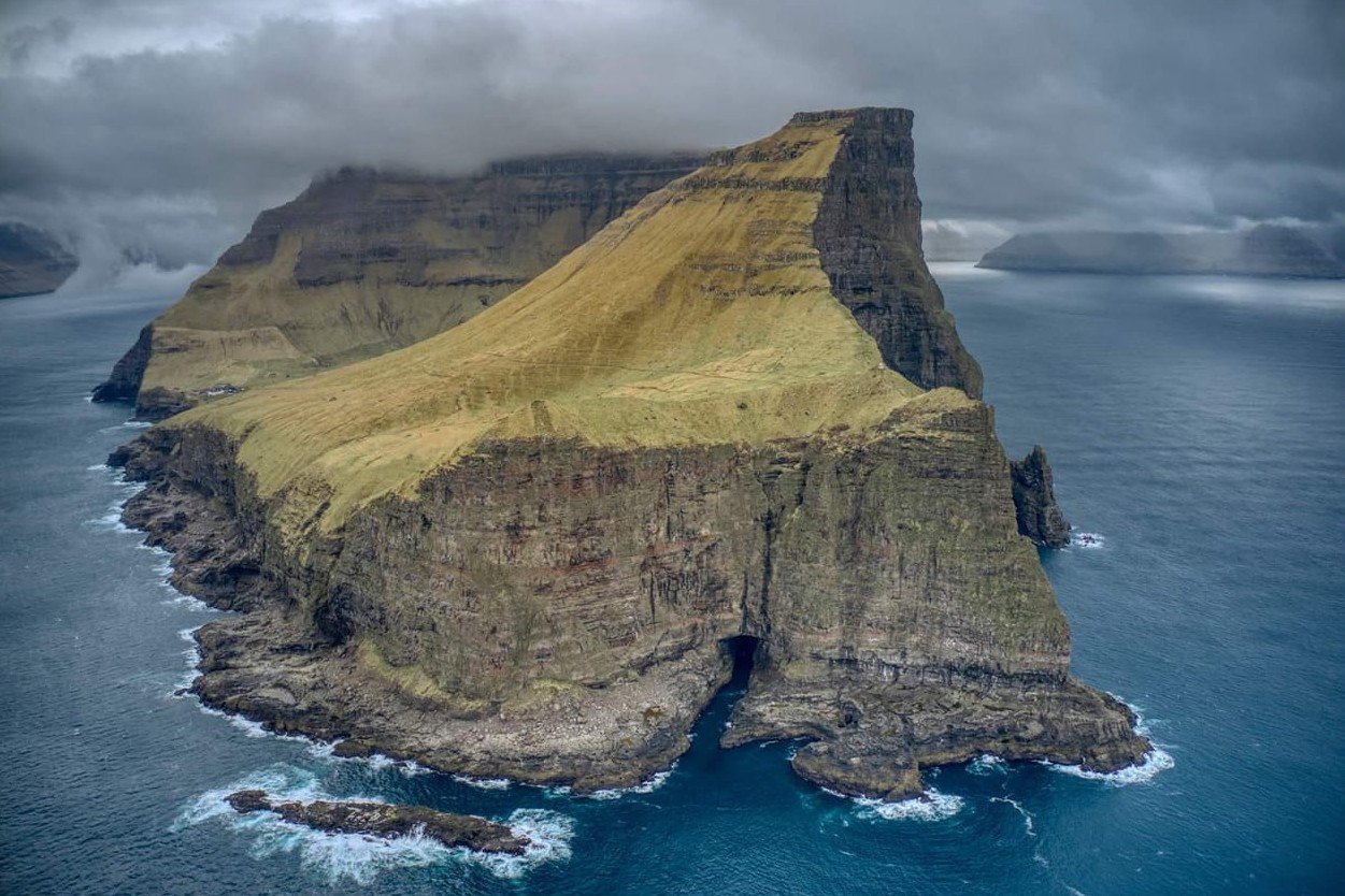 Kallur, Faroe Islands. Big mountain cliff, steep drop into the ocean