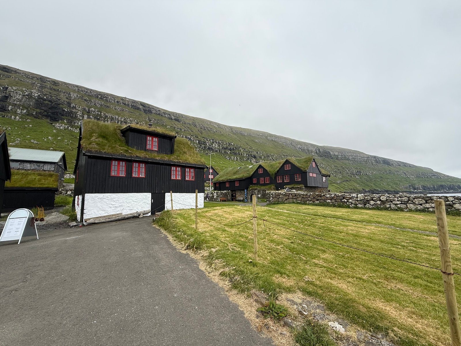 black house, turf roof and red windows, classic kirkjubøur style